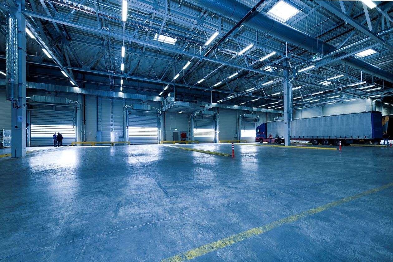 Clean, well-lit loading dock and staging area inside a modern distribution center